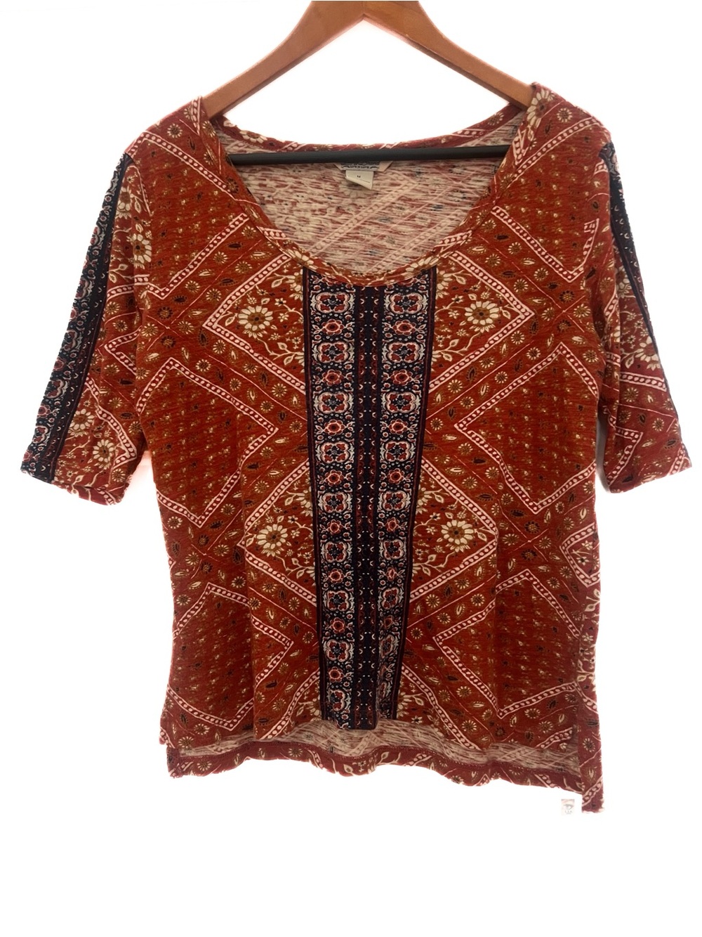 Lucky Brand  rust and navy blue patterned top. Size medium